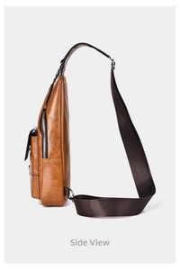 Side view of brown leather chest bag showing texture, metal zipper and shoulder strap