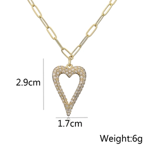Detail showing gold heart pendant dimensions 2.9cm by 1.7cm with weight 6g on paperclip chain