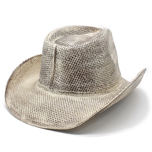 Detailed close-up of brown and beige woven texture on a vintage western cowboy hat