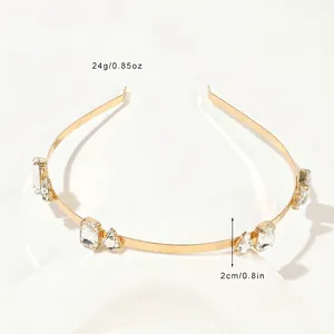 Detailed view of golden metal headband with crystal rhinestones showing dimensions and weight