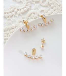 Detailed view of adjustable 18k gold plated ear jackets with sparkling cubic zirconia