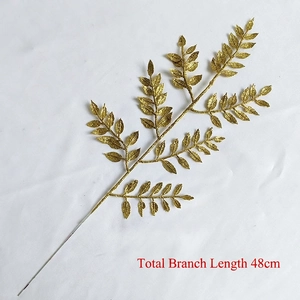 Detail of a 48cm golden glitter artificial leaf spray for festive holiday floral decorations