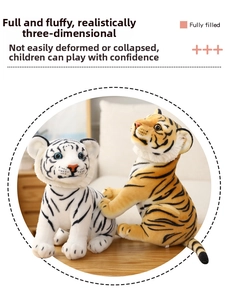 Detailed plush tiger toys with realistic stripes and full cotton padding on wood surface
