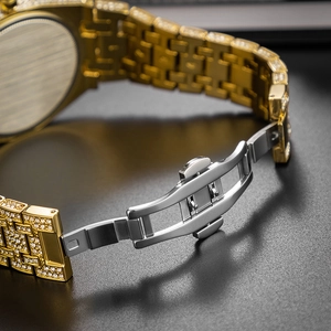 Close-up of gold-plated butterfly clasp fully iced out with sparkling white crystals