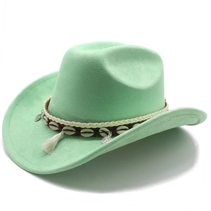 Detail of mint green suede cowboy hat with white tassels, shells and coin charms