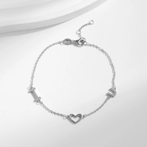S925 Sterling Silver hollow heart bracelet with small diamond accents and adjustable chain