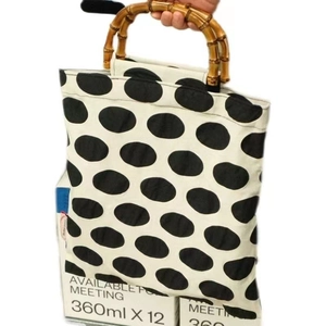Retro polka dot canvas handbag featuring bamboo handles and a double-layer design