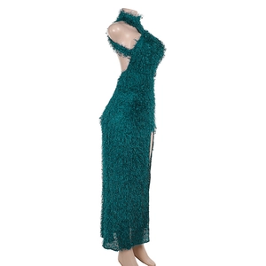 Detail of dark green halter dress with textured faux feather fabric and high side slit