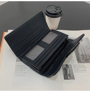 Internal layout of black quilted wallet showing card slots, ID windows and zipper pocket