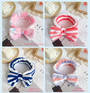 Detail of soft coral fleece headbands in leopard, stripe and strawberry patterns