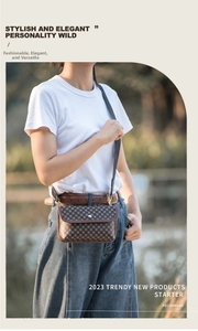 Close-up of a brown textured crossbody square bag with a silver metal clasp buckle