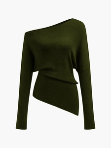 Detail of dark green knit top featuring off-shoulder neckline and asymmetric hem