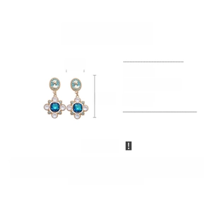 Detailed view of bohemian vintage cameo earrings with blue stones and dimensions