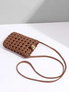 Brown woven crossbody phone bag with gold spherical buckle and minimalist slim shoulder strap