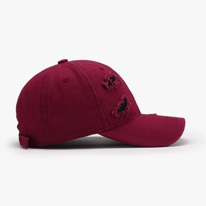 Distressed cotton canvas baseball cap in wine red with vintage ripped streetwear details