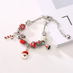 DIY Christmas charm bracelet with snowman, candy cane and snowflake charms on snake chain