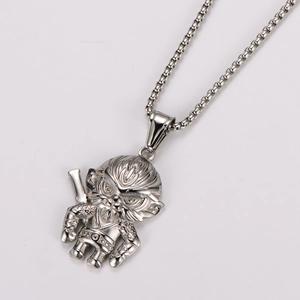 Detailed close-up of a silver stainless steel Monkey King pendant on a box chain necklace