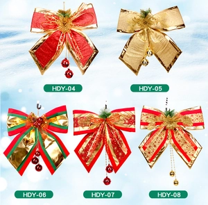 Detail showing five assorted Christmas bows with bells, pine cones and festive patterns