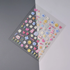 Detail of 3D embossed nail stickers featuring colorful tulips, bunnies and flowers