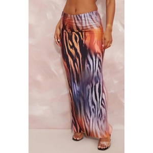 Detail shot of the tiger animal print fabric on a slim fit high waist maxi skirt