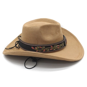 Detail of camel suede cowboy hat with embroidered floral band and vintage metal buckle