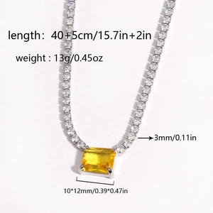 Detail view of silver tennis necklace with yellow rectangle gemstone and dimensions