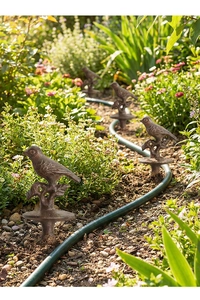 Set of four vintage cast iron bird garden stakes with rustic bronze finish for patio decor