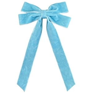 Detail of light blue velvet double bow hair accessory with long ribbons on white background