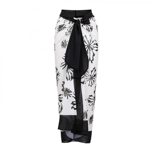 Women's white sarong wrap skirt with black floral print and large waist bow tie