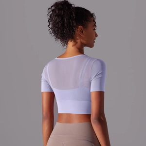 Detail view of the breathable mesh back and lavender purple fabric on this sports crop top
