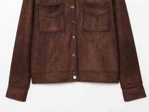 Detail view of brown faux suede jacket featuring metal buttons and large front pockets