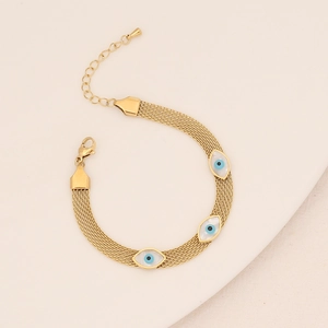 Detail of gold woven mesh chain necklace with three blue evil eye charms and lobster clasp