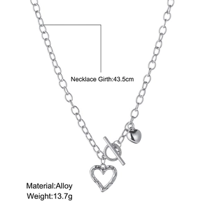 Silver alloy toggle necklace detail showing heart pendants and 43.5cm chain length