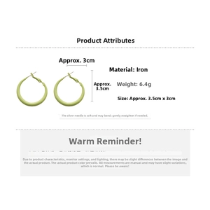 Detail of light green matte geometric hoop earrings with dimensions and silver needle