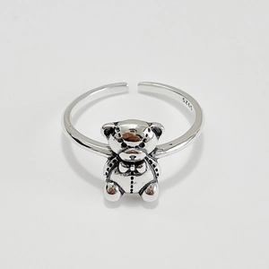 Macro shot of S925 sterling silver ring detail with retro bear design and hallmark