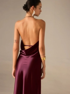 Elegant deep purple satin backless halter dress featuring a silky finish and floor-length cut