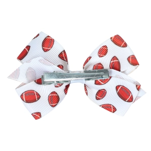 White grosgrain bow hair clip with red football print and metal alligator clip