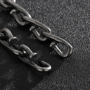 Close-up of retro titanium steel nail chain bracelet with interlocking hook design for men