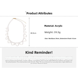 Detailed view of clear acrylic heart necklace with size specs and gold-tone lobster clasp