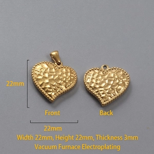 Macro detail of 22mm 18k gold heart pendant showing front and back hammered texture