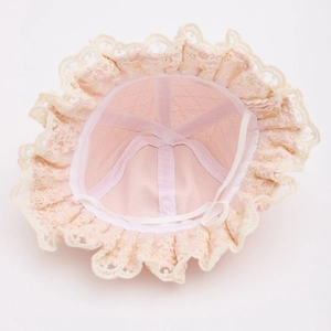 Detail of pink baby sun hat showing soft fabric lining and white elastic chin strap