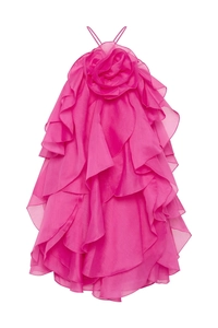 Detail of rose pink halter dress featuring 3D floral accent and layered ruffles