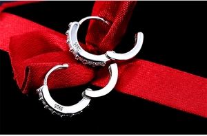 Close-up of S925 sterling silver hoop earrings with sparkling cubic zirconia inlay