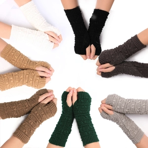Winter knitted fingerless arm warmers in various colors including black and white