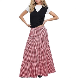 Detail of high waist red gingham tiered maxi skirt with elastic waistband and A-line silhouette