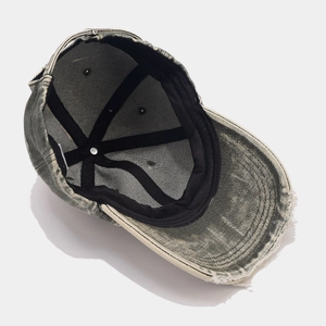 Washed cotton vintage baseball cap with distressed brim and internal structure details