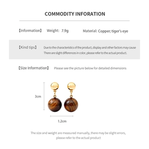 Detailed view of 18k gold plated tiger eye earrings showing dimensions of 3cm by 1.2cm