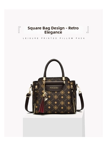 Deep brown printed pillow bag featuring a red tassel and gold-tone zipper details