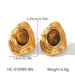 Detail view of retro gold earrings with tiger eye stone including size and weight specs