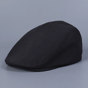 Detailed side view of a classic black ivy cap featuring smooth cotton fabric and flat peak